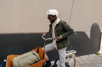 Man riding a cargo bike transporting a bag