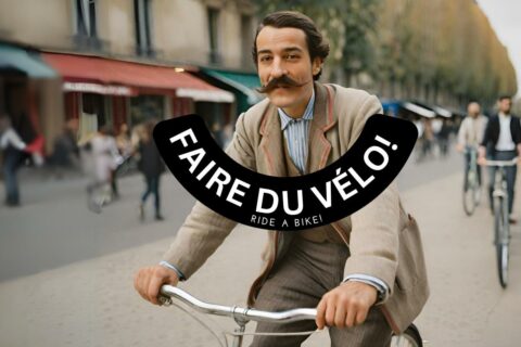 French man with a moustache riding a bicycle in Paris